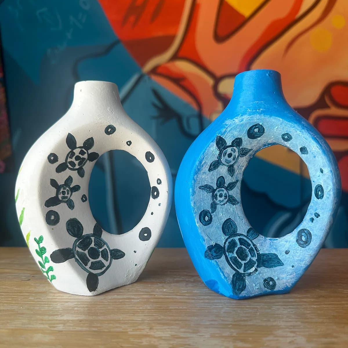 Two glazed ceramic vases painted with turtles